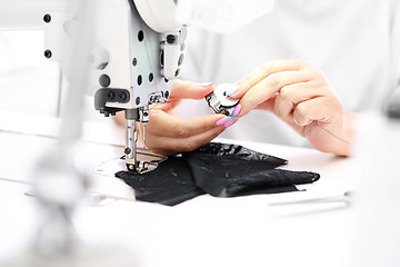 Image showing Factory, sewing room. Production of apparel. Occupation needlewoman.