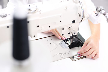 Image showing Constructor. Sewing on a machine.  Sewing machine  Sewing. Sewing machine 