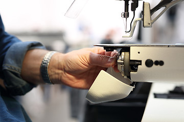 Image showing Seamstress. Sewing. Factory, sewing room.