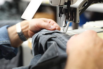 Image showing Design clothes . Constructor. Sewing on a machine. 