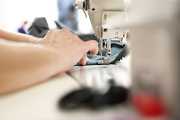 Image showing Occupation needlewoman. Sewing underwear.