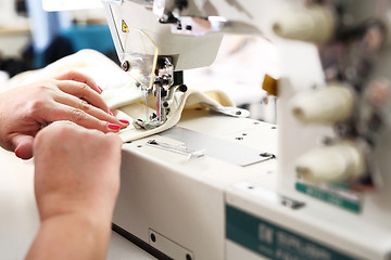 Image showing Sewing. Factory, sewing room. Production of apparel.