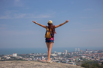 Image showing Girl standing with hands up