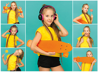 Image showing Pretty skater girl holding skateboard