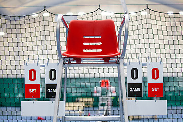 Image showing Umpire chair with scoreboard on a tennis court before the game.