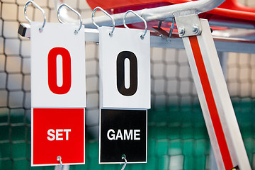 Image showing Umpire chair with scoreboard on a tennis court before the game.