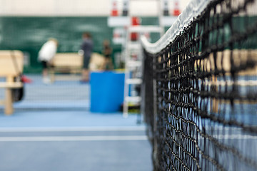 Image showing Close up view of tennis court through the net