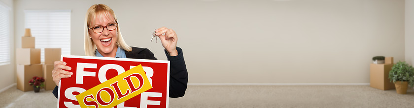 Image showing Banner of Adult Woman Inside Room with Boxes Holding House Keys 