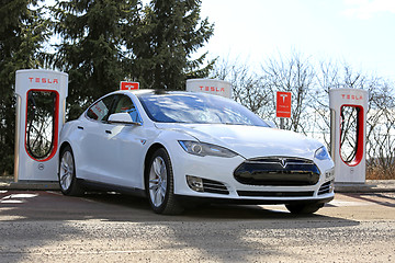 Image showing White Tesla Model S P85D Plugged on Supercharger