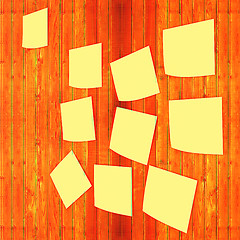 Image showing Mock-up of Sticky note paper on a wooden wall. 3D illustration. 