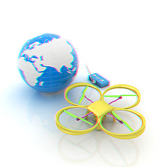 Image showing Quadrocopter Drone with Earth Globe and remote controller on a w