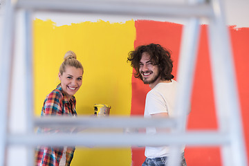 Image showing couple painting interior wall