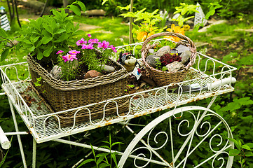 Image showing Flower cart in garden