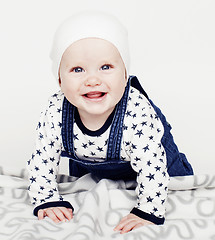 Image showing little cute baby toddler on carpet isolated close up smiling ado