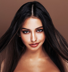 Image showing cute happy young indian woman in studio close up smiling, fashion mulatto