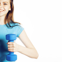 Image showing young pretty brunette woman with blue dumbbell isolated cheerful