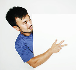 Image showing pretty cool asian man holding empty white plate smiling