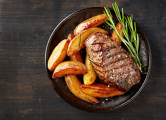 Image showing grilled beef steak and potatoes