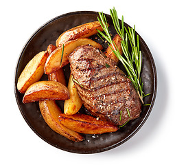 Image showing grilled beef steak and potatoes