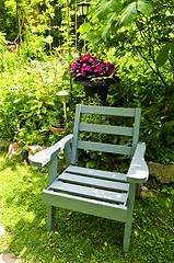 Image showing Chair in green garden