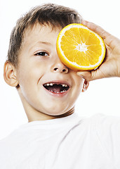 Image showing little cute boy with orange fruit double isolated on white smili