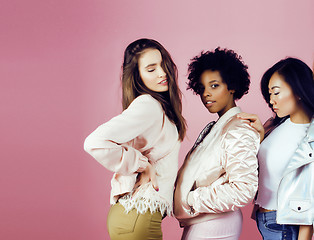 Image showing different nation girls with diversuty in skin, hair. Asian, scandinavian, african american cheerful emotional posing on pink background, woman day celebration, lifestyle people concept 