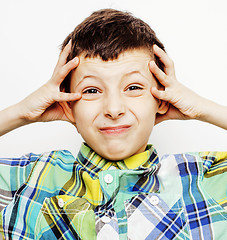 Image showing young pretty little cute boy kid wondering, posing emotional face isolated on white background, gesture happy smiling close up, lifestyle people concept 