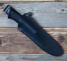 Image showing steel hunting knife in leather sheath