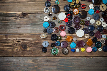Image showing vintage buttons on the wooden boards