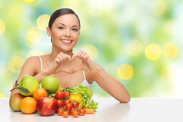 Image showing woman with fruits and vegetables showing heart