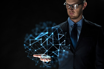 Image showing close up of businessman with network projection