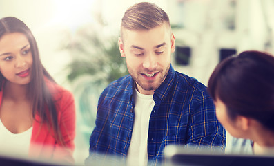 Image showing happy creative team or students working at office