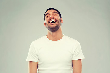 Image showing laughing man over gray background