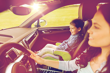 Image showing happy woman with little girl driving in car