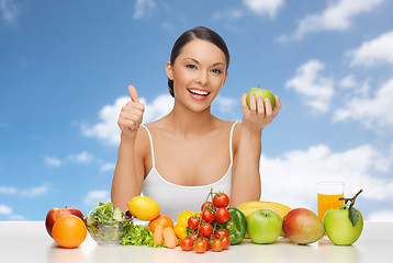 Image showing woman with fruits and vegetables showing thumbs up
