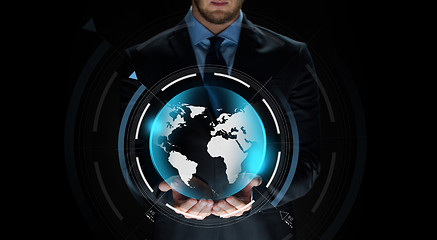 Image showing close up of businessman with earth projection