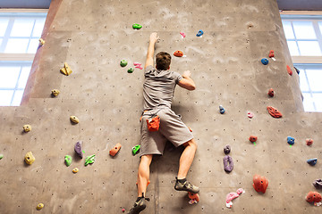 Image showing young man exercising at indoor climbing gym