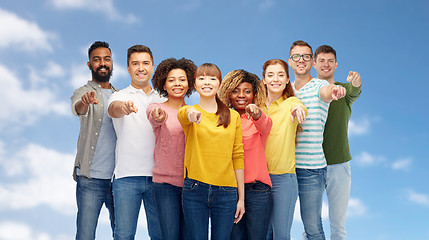 Image showing international group of people pointing on you