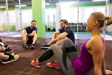 Image showing group of happy friends resting in gym