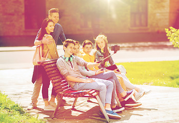 Image showing happy teenage students taking selfie by smartphone