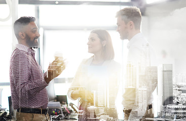 Image showing happy business team drinking coffee at office