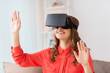 Image showing happy woman in virtual reality headset at home