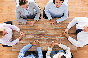 Image showing business people sitting at office table