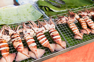 Image showing squids on grill at street market