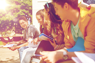 Image showing group of students with notebooks at school yard