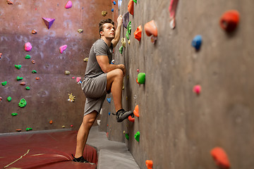 Image showing young man exercising at indoor climbing gym