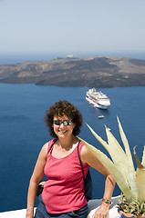 Image showing smiling middle-age tourist in santorini greece