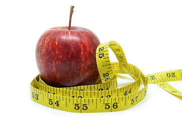 Image showing Red apple with measure tape