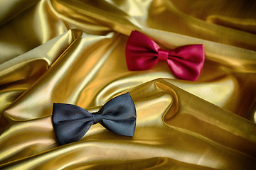 Image showing Red and black bow ties