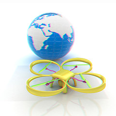 Image showing Quadrocopter Drone with Earth Globe and remote controller on a w